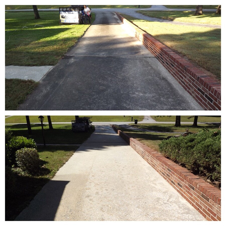 Two photos of a concrete driveway bordered by a low red brick wall (right side). Top image: driveway appears weathered, surrounded by greenery with a cart in the distance. Bottom image: after pressure washing, the driveway surface appears freshly cleaned or refurbished, with plants and the same cart in the background.